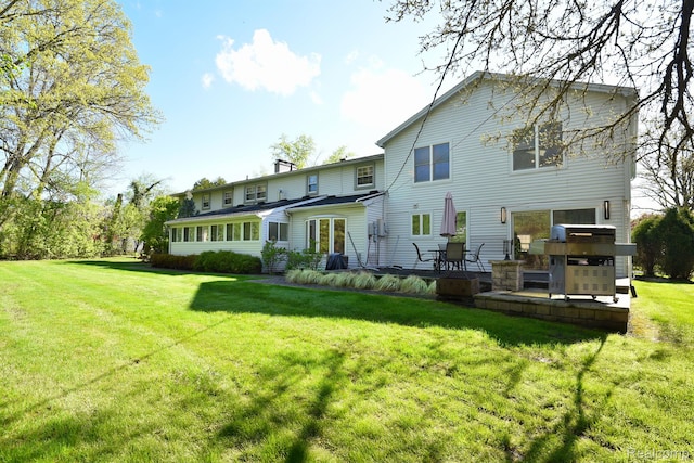 5100 Kings Gate Way, Bloomfield Hills, MI 48302 - rear view of house featuring a lawn, a patio, and a chimney