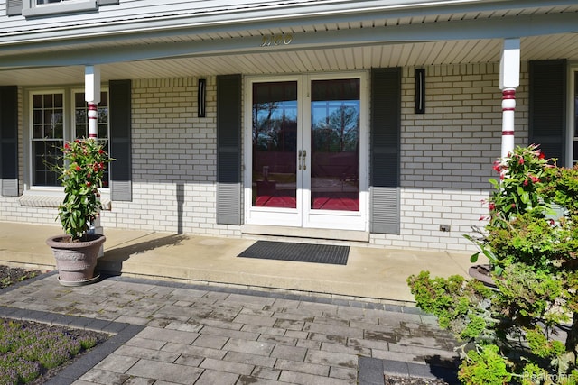 5100 Kings Gate Way, Bloomfield Hills, MI 48302 - property entrance featuring brick siding, french doors, and a porch