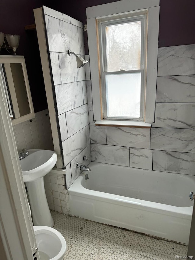 19656 Mitchell St, Detroit, MI 48234 - full bath featuring tile patterned flooring, tile walls, and shower / bathtub combination
