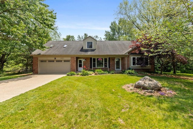 4662 60th St SW, Wyoming, MI 49418 - view of front of house with a garage, brick siding, driveway, and a front yard