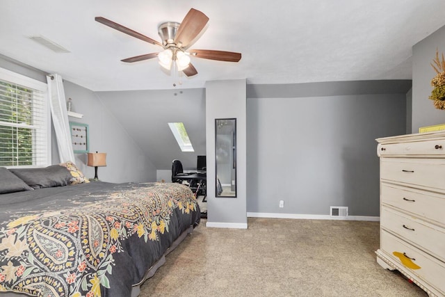 4662 60th St SW, Wyoming, MI 49418 - bedroom featuring a skylight, lofted ceiling, light carpet, and a ceiling fan
