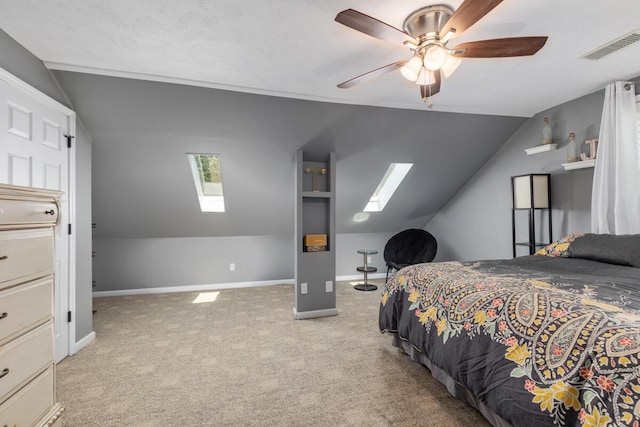 4662 60th St SW, Wyoming, MI 49418 - bedroom with a skylight, vaulted ceiling, light carpet, and ceiling fan