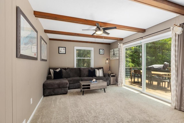 4662 60th St SW, Wyoming, MI 49418 - carpeted living room featuring beamed ceiling and ceiling fan