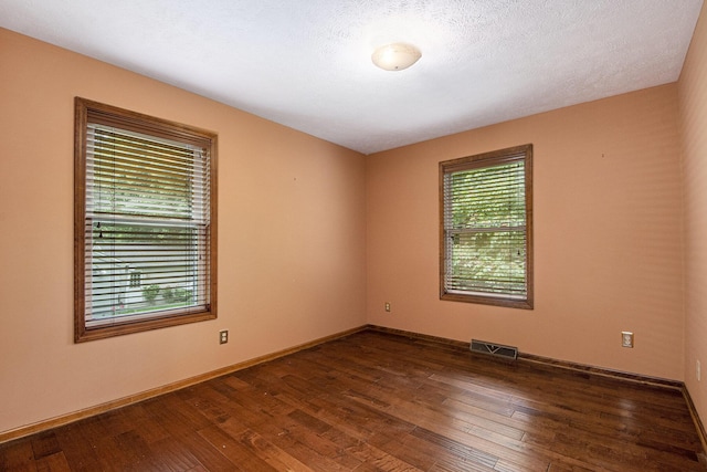 238 Baynton Ave NE, Grand Rapids, MI 49503 - empty room with dark wood-style floors and baseboards
