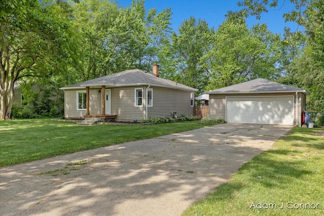 3655 Giddings Ave SE, Grand Rapids, MI 49508 - view of front facade with a chimney, a garage, and a front lawn