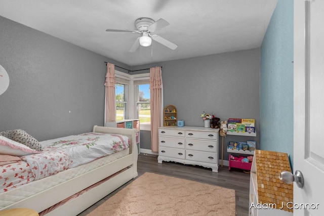 3655 Giddings Ave SE, Grand Rapids, MI 49508 - bedroom with dark wood-type flooring and ceiling fan