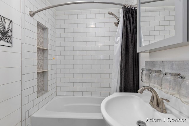 3655 Giddings Ave SE, Grand Rapids, MI 49508 - bathroom featuring a sink and shower / bath combination with curtain