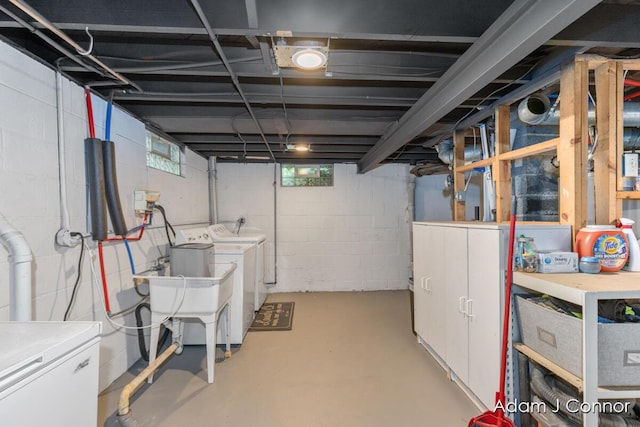 3655 Giddings Ave SE, Grand Rapids, MI 49508 - basement featuring washing machine and clothes dryer and a sink