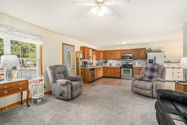 50 S Bock Rd, Muskegon, MI 49442 - kitchen featuring open floor plan, stainless steel appliances, light countertops, and a ceiling fan