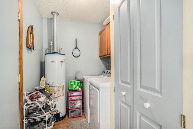 50 S Bock Rd, Muskegon, MI 49442 - washroom with water heater, separate washer and dryer, cabinet space, a textured ceiling, and light wood-style floors