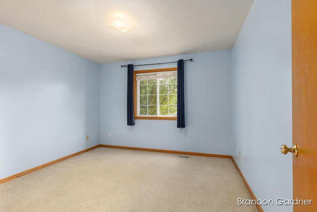 626 Lasalle Ave NW, Grand Rapids, MI 49534 - spare room with carpet floors and baseboards