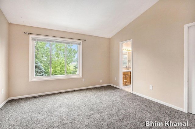2492 Sunny Creek St SE, Kentwood, MI 49508 - spare room with vaulted ceiling and carpet flooring