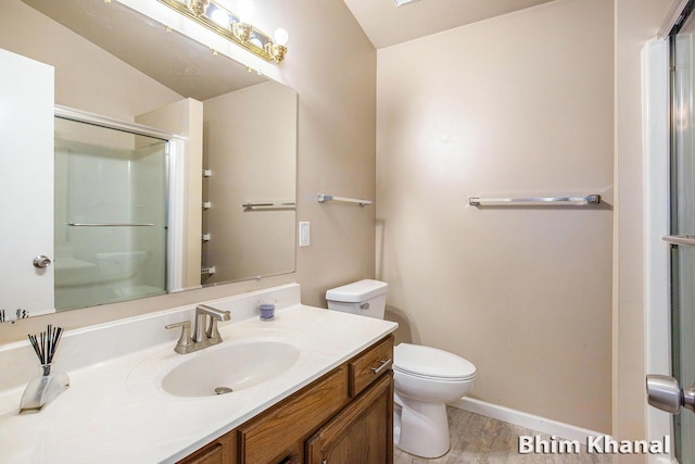 2492 Sunny Creek St SE, Kentwood, MI 49508 - bathroom featuring a shower with door, vanity, and wood finished floors