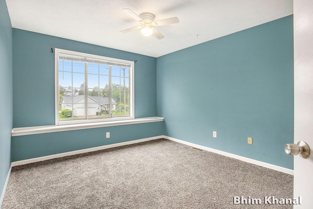 2492 Sunny Creek St SE, Kentwood, MI 49508 - carpeted empty room with a ceiling fan and baseboards