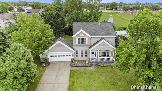 2492 Sunny Creek St SE, Kentwood, MI 49508 - view of front facade featuring covered porch, concrete driveway, an attached garage, and a shingled roof