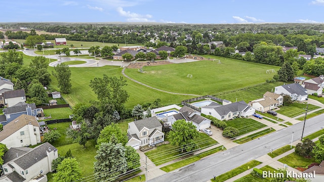2492 Sunny Creek St SE, Kentwood, MI 49508 - aerial perspective of suburban area featuring a tree filled landscape