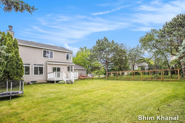 2492 Sunny Creek St SE, Kentwood, MI 49508 - view of yard with a trampoline and a deck