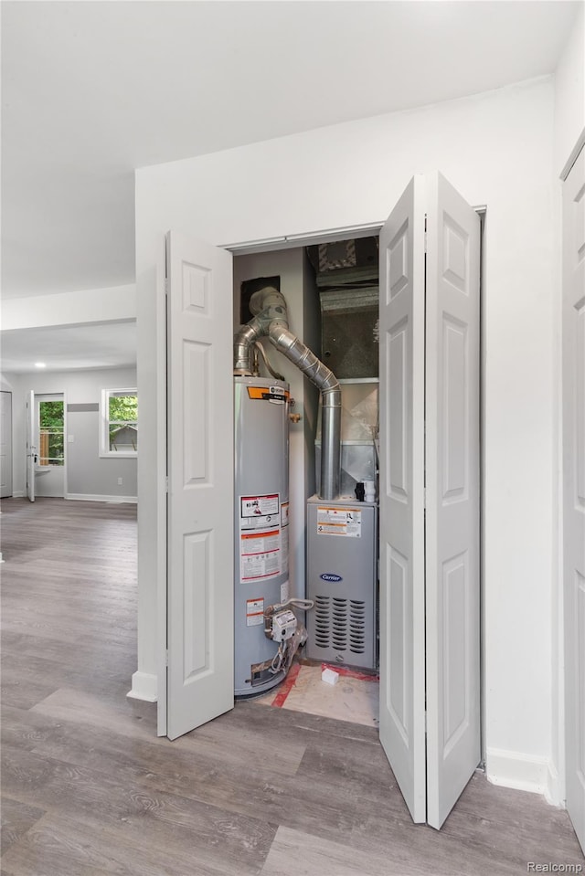 3166 Highland Blvd, Highland, MI 48356 - utility room with gas water heater