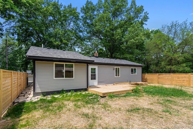 3166 Highland Blvd, Highland, MI 48356 - rear view of property with a fenced backyard and a wooden deck