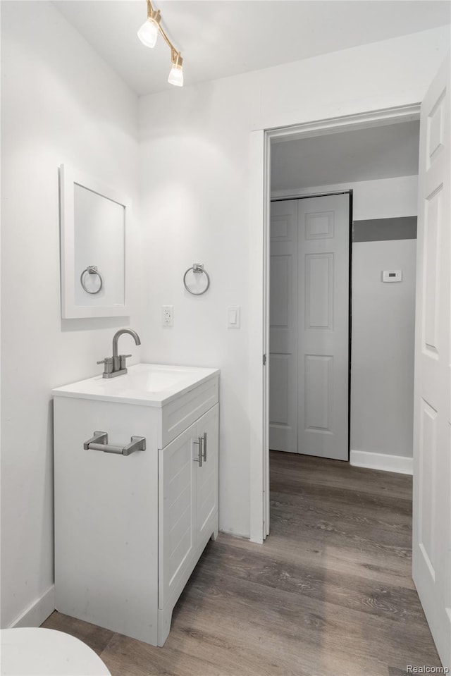 3166 Highland Blvd, Highland, MI 48356 - bathroom featuring vanity and wood finished floors