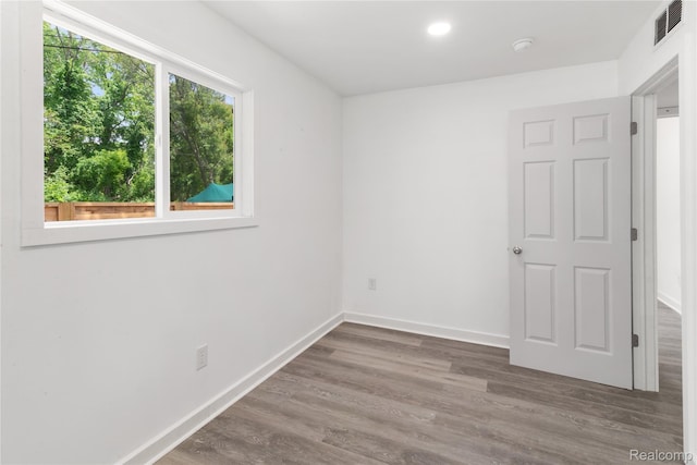 3166 Highland Blvd, Highland, MI 48356 - spare room with wood finished floors, a smoke detector, and recessed lighting