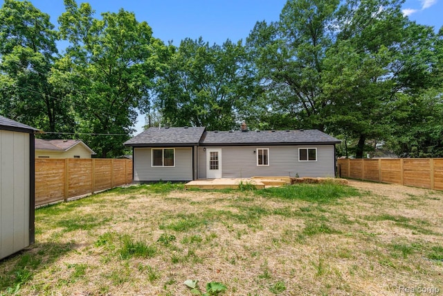 3166 Highland Blvd, Highland, MI 48356 - back of property with a fenced backyard and a patio