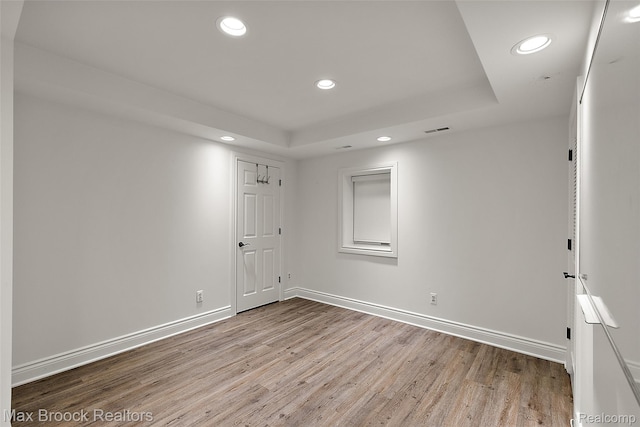 222 Arlington St, Birmingham, MI 48009 - unfurnished room with recessed lighting, wood finished floors, and a tray ceiling