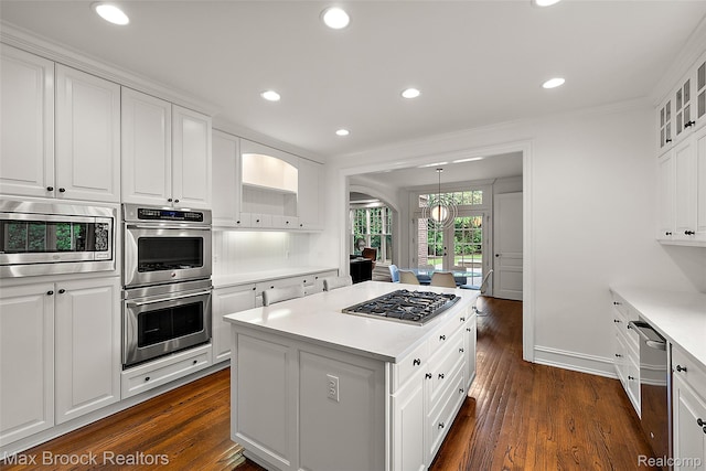 222 Arlington St, Birmingham, MI 48009 - kitchen with stainless steel appliances, a center island, white cabinets, recessed lighting, and ornamental molding