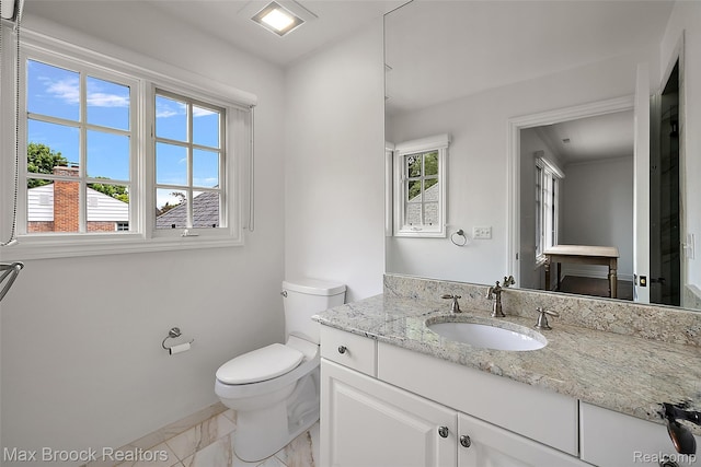 222 Arlington St, Birmingham, MI 48009 - bathroom featuring vanity and marble look tiles
