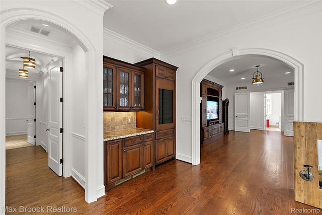 222 Arlington St, Birmingham, MI 48009 - corridor with arched walkways, dark wood-type flooring, ornamental molding, and recessed lighting
