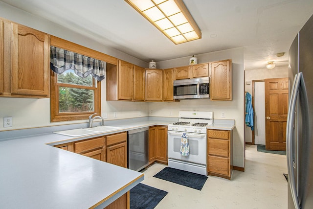 1142 N Peach Ct, Plainwell, MI 49080 - kitchen with appliances with stainless steel finishes and light countertops