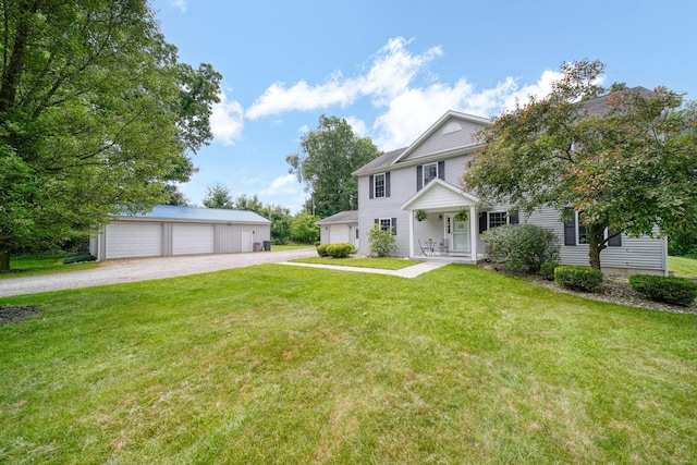 14715 Allman Rd, Concord, MI 49237 - view of front of home featuring a garage, a front lawn, and an outdoor structure