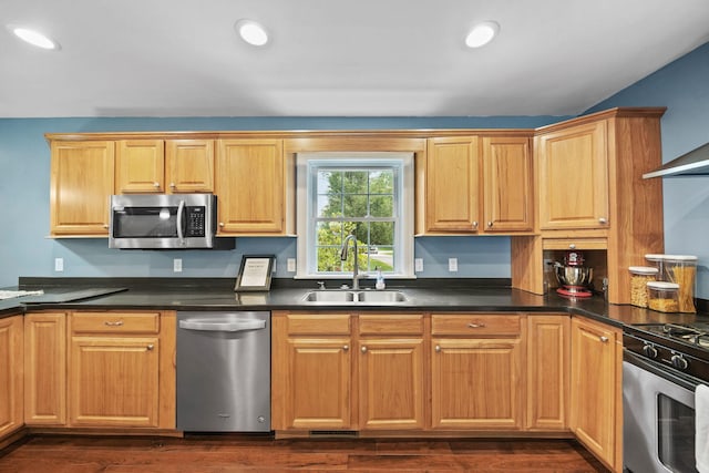 14715 Allman Rd, Concord, MI 49237 - kitchen featuring stainless steel appliances, dark countertops, dark wood-type flooring, and recessed lighting