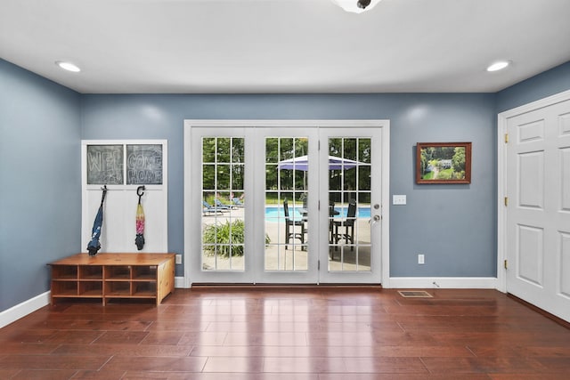 14715 Allman Rd, Concord, MI 49237 - doorway to outside featuring wood finished floors and recessed lighting