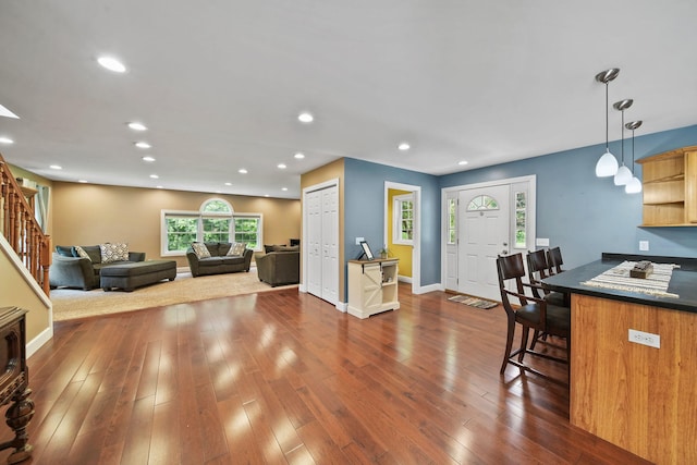 14715 Allman Rd, Concord, MI 49237 - kitchen with a breakfast bar, open shelves, dark wood-type flooring, pendant lighting, and recessed lighting