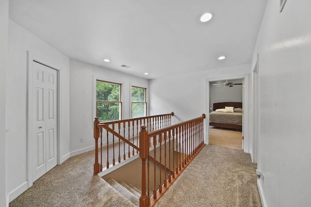 14715 Allman Rd, Concord, MI 49237 - hall featuring carpet floors, an upstairs landing, and recessed lighting