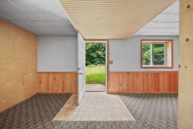 14715 Allman Rd, Concord, MI 49237 - doorway to outside with wood walls and wainscoting