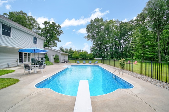 14715 Allman Rd, Concord, MI 49237 - view of pool with a patio, a diving board, and view of wooded area