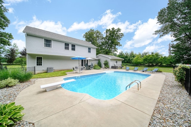 14715 Allman Rd, Concord, MI 49237 - view of pool with a patio area, a diving board, and outdoor dining space
