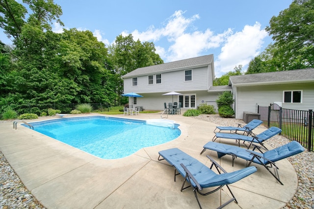 14715 Allman Rd, Concord, MI 49237 - view of pool featuring a patio, outdoor dining space, and french doors