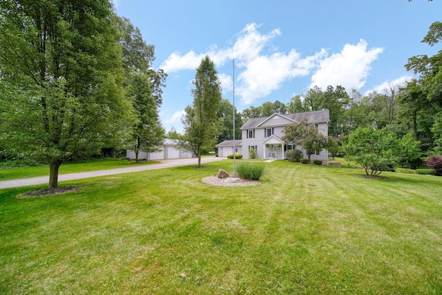 14715 Allman Rd, Concord, MI 49237 - view of green lawn with driveway and an attached garage