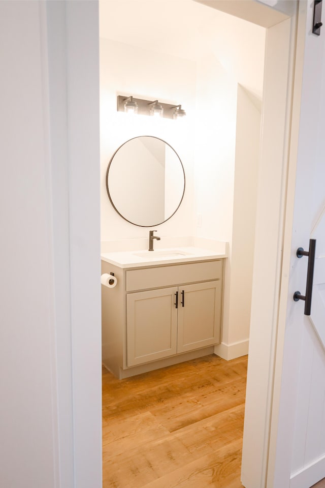 2458 Maes Rd, West Branch, MI 48661 - bathroom featuring vanity and wood finished floors