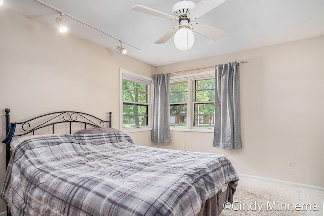 3343 Gateshead St NE, Rockford, MI 49341 - carpeted bedroom featuring track lighting and a ceiling fan