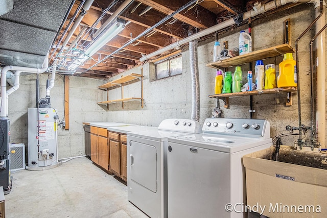 3343 Gateshead St NE, Rockford, MI 49341 - washroom with independent washer and dryer, gas water heater, and cabinet space