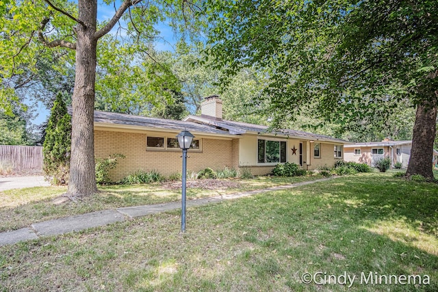 3343 Gateshead St NE, Rockford, MI 49341 - ranch-style home featuring brick siding and a chimney
