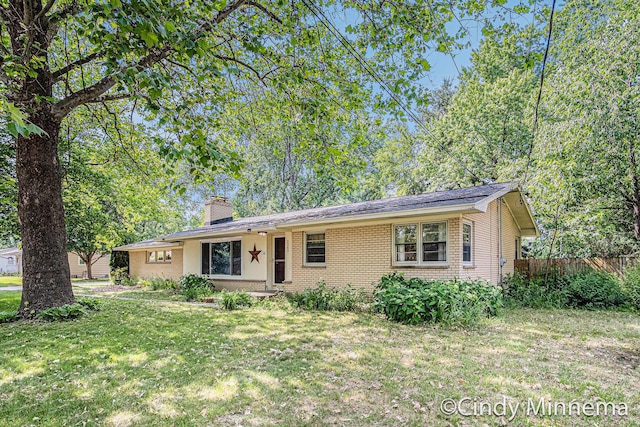 3343 Gateshead St NE, Rockford, MI 49341 - ranch-style house with brick siding and a chimney