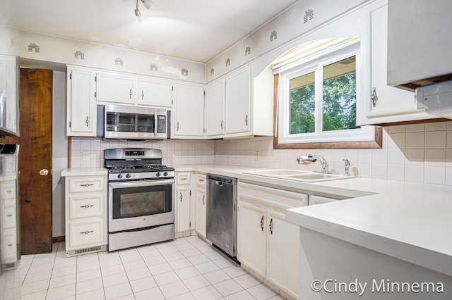 3343 Gateshead St NE, Rockford, MI 49341 - kitchen with appliances with stainless steel finishes, light countertops, tasteful backsplash, and white cabinetry