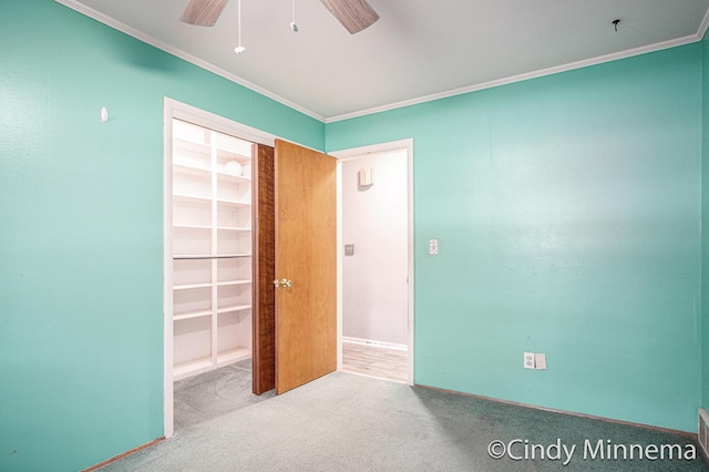 3343 Gateshead St NE, Rockford, MI 49341 - spare room with ornamental molding, carpet, and a ceiling fan