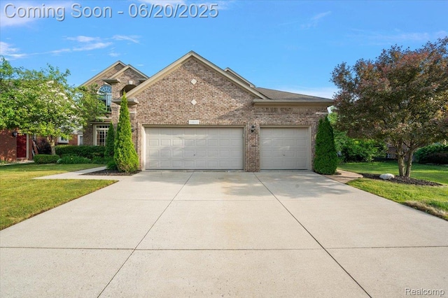 18852 Newbridge Dr, Macomb, MI 48044 - traditional home with concrete driveway, a garage, a front yard, and brick siding