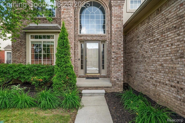 18852 Newbridge Dr, Macomb, MI 48044 - property entrance featuring brick siding